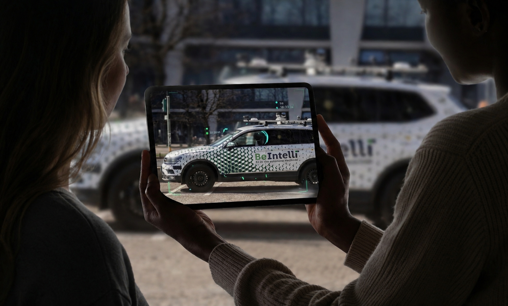 BeIntelli — a tablet showing an AR view of the autonomous test vehicle